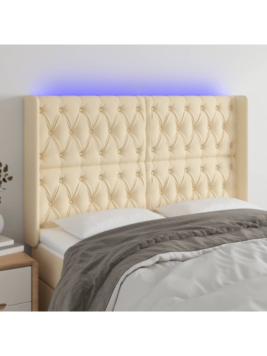 Čelo postele s led krémové 147 x 16 x 118/128 cm textil