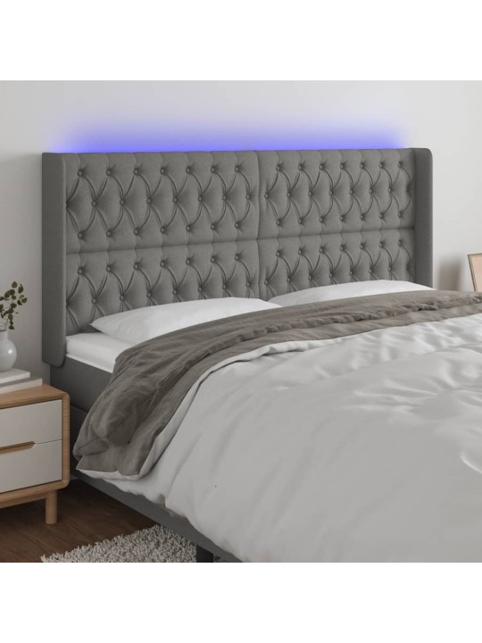 Čelo postele s LED tmavě šedé 203 x 16 x 118/128 cm textil