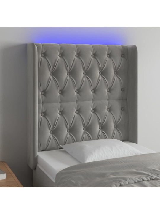 Čelo postele s LED světle šedé 83 x 16 x 118/128 cm samet