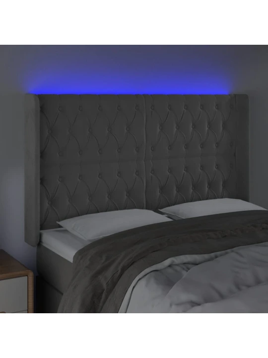 Čelo postele s led světle šedé 147x16x118/128 cm samet