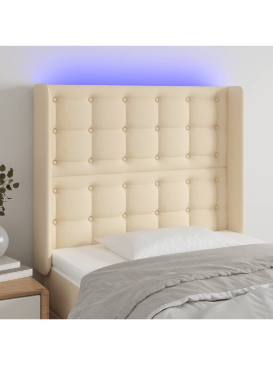 Čelo postele s led krémové 83 x 16 x 118/128 cm textil