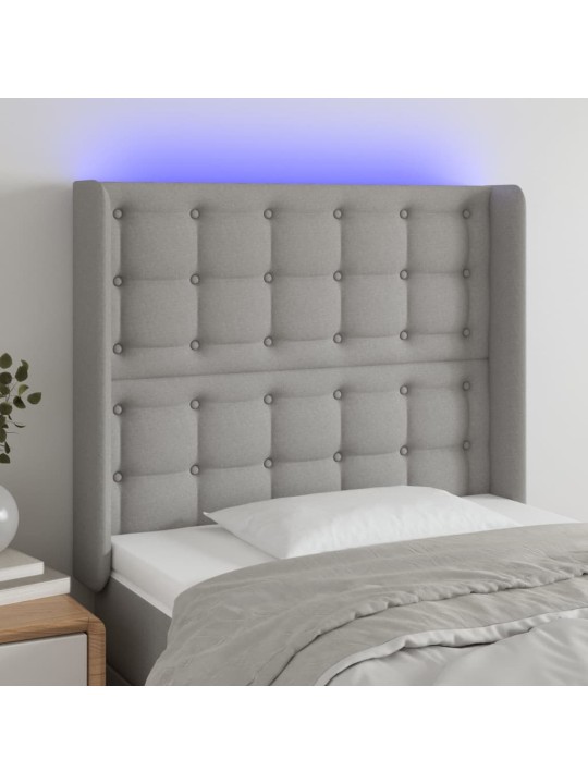 Čelo postele s LED světle šedé 103x16x118/128 cm textil