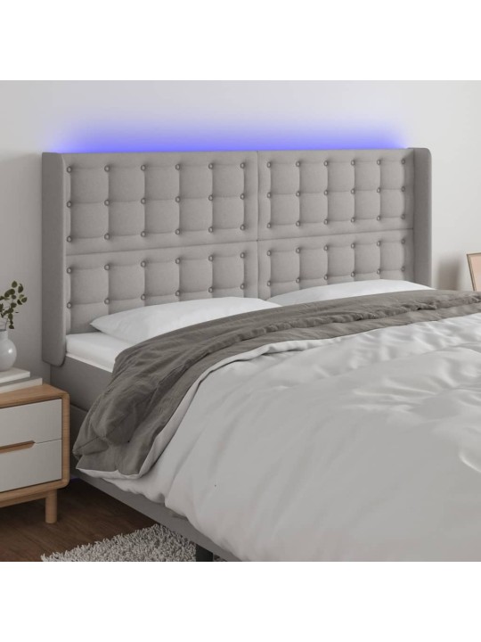 Čelo postele s LED světle šedé 183x16x118/128 cm textil