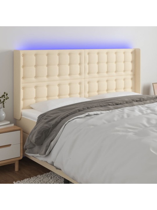 Čelo postele s LED krémové 183 x 16 x 118/128 cm textil