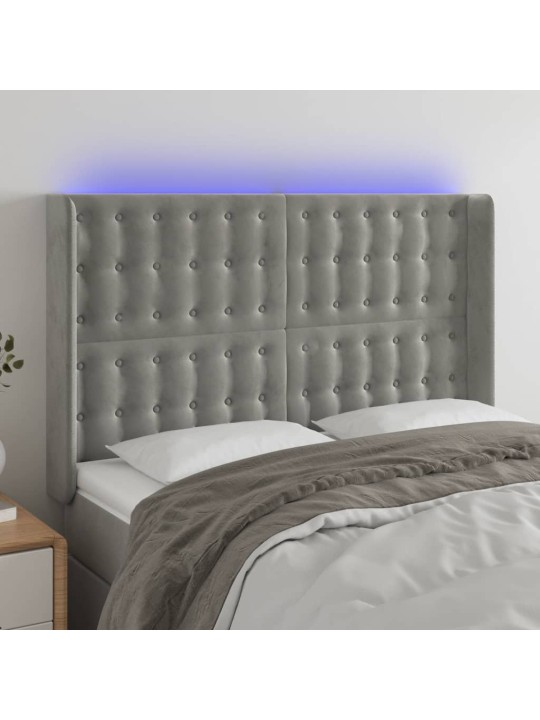 Čelo postele s LED světle šedé 147x16x118/128 cm samet