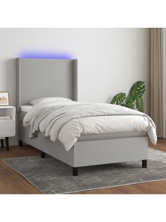 Box spring postel s matrací a LED světle šedá 90x200 cm textil