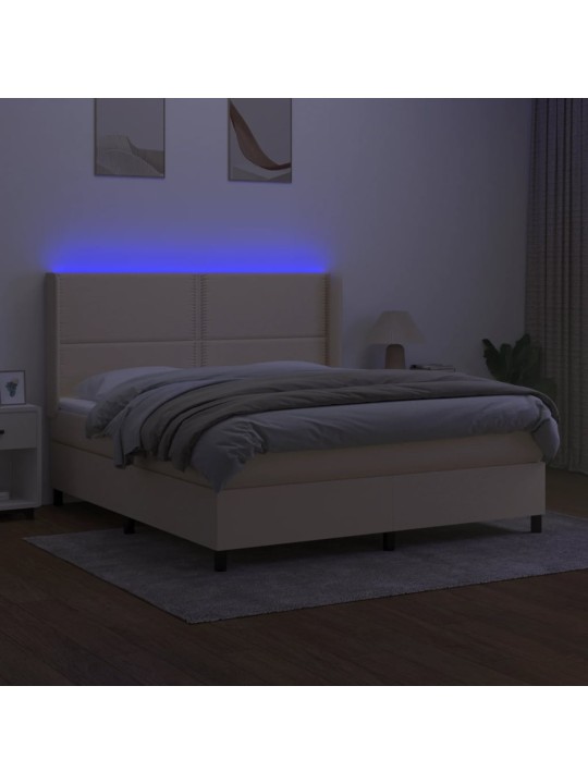 Box spring postel s matrací a LED krémová 180x200 cm textil