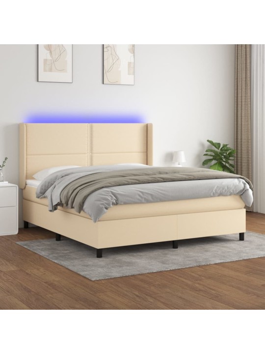 Box spring postel s matrací a LED krémová 180x200 cm textil