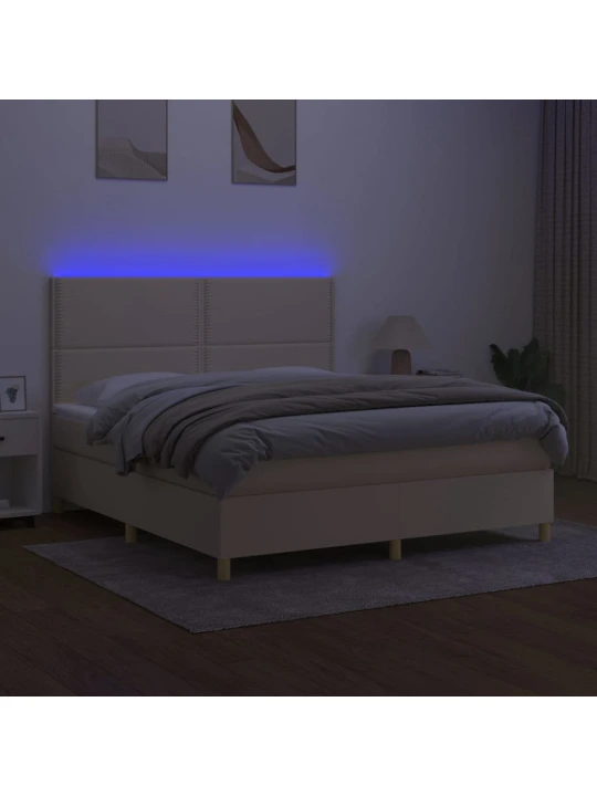 Box spring postel s matrací a LED krémová 180x200 cm textil