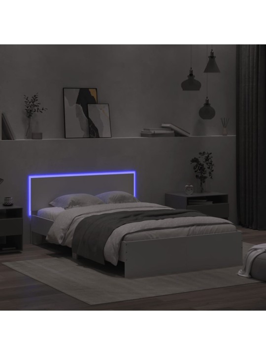 Rám postele s čelem a LED osvětlením bílý 135 x 190 cm