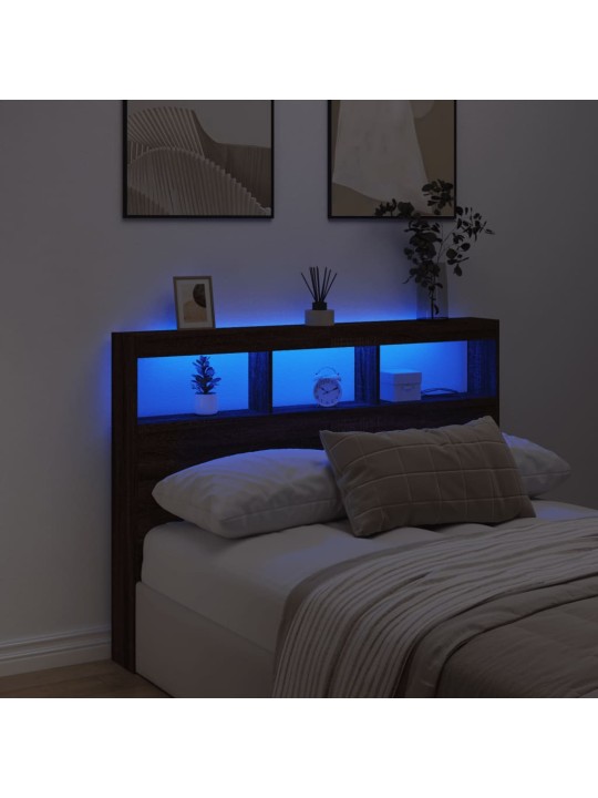 Čelo postele s úložným prostorem a led hnědý dub 140x17x102 cm